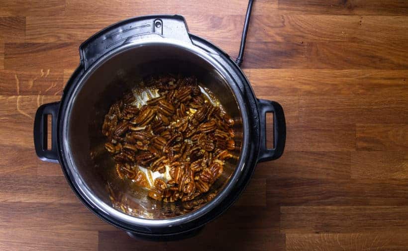 stir pecans with maple sriracha sauce