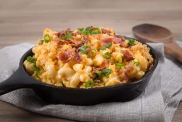 Loaded Instant Pot Mac and Cheese Recipe: Piping hot elbow macaroni swimming in creamy cheddar cheese sauce. Sprinkled with buttery toasted golden breadcrumbs, smoky crispy bacon bits, and crunchy scallions. Indulge in this ultimate kid-friendly comfort food.