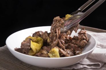 Make Instant Pot Mississippi Pot Roast Recipe (Pressure Cooker Mississippi Pot Roast) that took internet by storm! Families are obsessed with this delicious pepperoncini beef roast - comfort food with minimal prep.