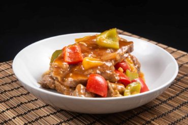 Instant Pot Sweet 'n Sour Pork Chops Recipe. Make this Top Selling Chinese Takeout: tender, juicy Pressure Cooker Pork Chops in a deliciously sweet and sour yummy sauce. Add this to your easy weeknight meal plan! #instantpot #instapot #instantpotrecipes #pressurecooker #recipes #chineserecipes #porkrecipes