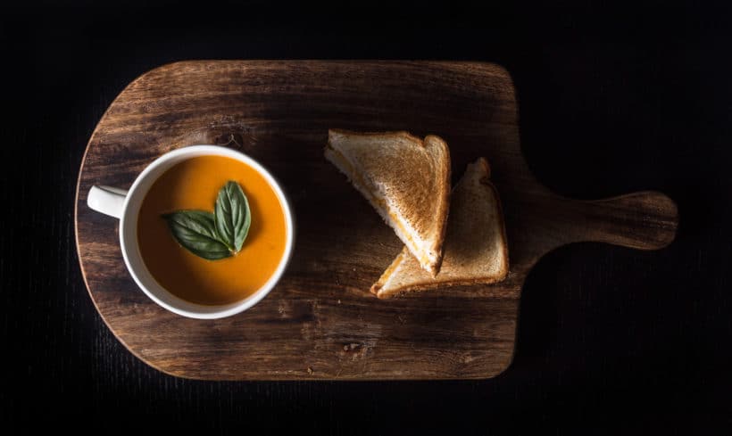 Make this Delicious Creamy Comfort: Instant Pot Tomato Soup Recipe (Pressure Cooker Tomato Soup)! This homemade tomato basil soup from scratch (with vegan option) is healthy, super easy to make, and freezer-friendly. Perfect dip for the toasted golden grilled cheese.