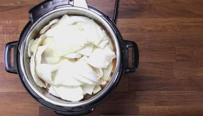 layer potatoes and cabbage on top, then pressure cook borscht soup