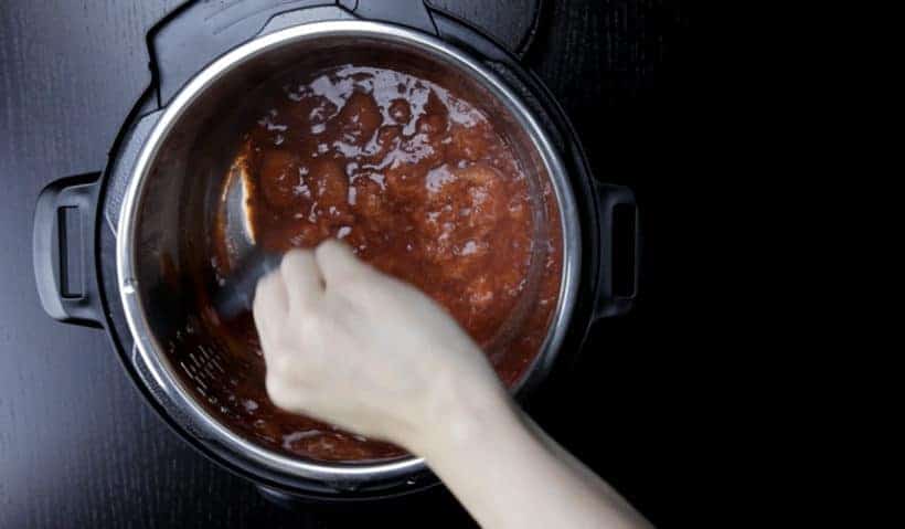 How to make Instant Pot Strawberry Compote Recipe (Pressure Cooker Strawberry Compote): add in sugar and stir to thicken the strawberry sauce